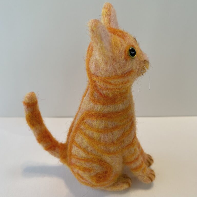 "Murray" (side view), needle felted wool, glass, and nylon, 4 x 2 x 3 inches, 2021 (Private Collection)